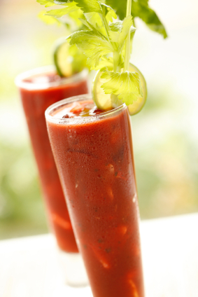 Two Bloody Marys with garnish.