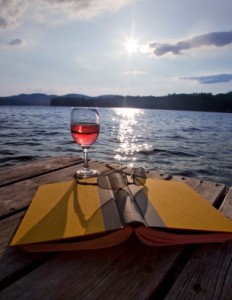 Glass of wine by the lake